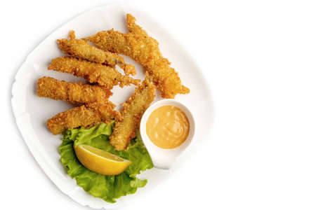 Fried battered fish fillet on white background.の写真素材
