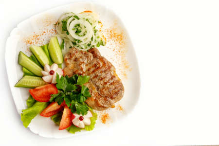 BBQ Steak. Barbecue Grilled Beef Steak Meat with Vegetables. Healthy Food. Barbeque Steak Dinner