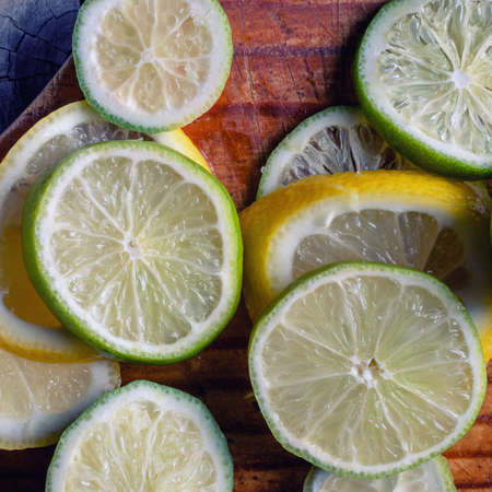 Citrus fruits. Oranges, limes and lemons. Over wood table background with copy spaceの写真素材