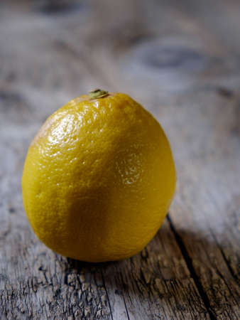 The beautiful yellow lemons on a wooden table, rusticの写真素材