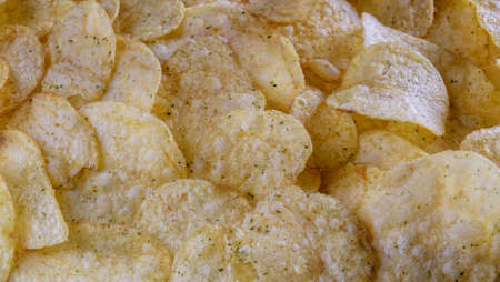 Background image with fried potato chips. Potatoesの写真素材