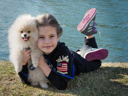 Image of young girl with her dogの写真素材