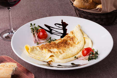 russian pancake folded on a white plate on the dark background, foodの写真素材