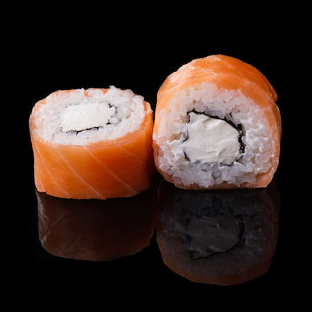 sushi medium set isolated on black backgroundの写真素材