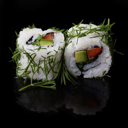 Sushi served on a black background with reflection.の写真素材