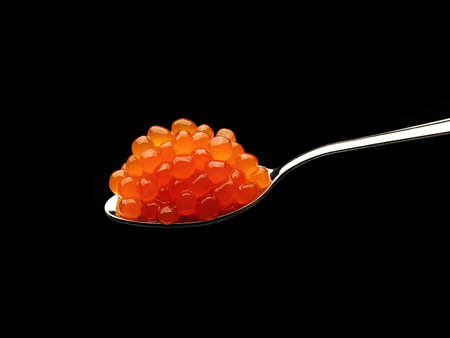Red caviar on a spoonの写真素材