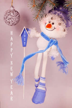 New Year banner with Christmas balls a Christmas tree and a snowman.の写真素材