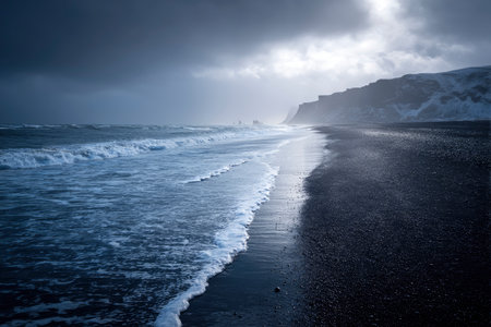 Icelandic black sand beach in winter with stormy sky.の素材