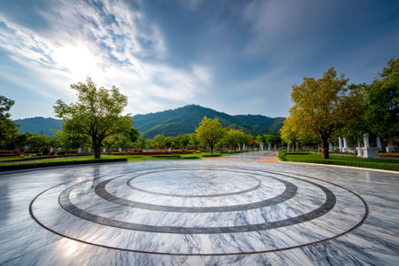 Empty marble floor in the park with blue sky and cloud background.の素材
