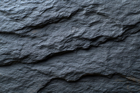 Dark grey stone texture or background. Natural pattern of black slate.の素材