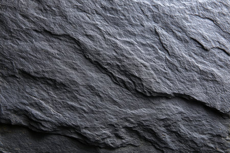 Dark grey black slate background or texture. Close up surface of stone.の素材