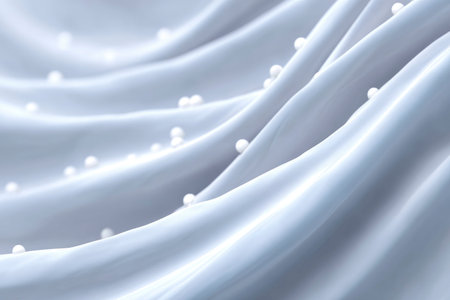 Closeup of white satin fabric with pearls, soft focusの素材