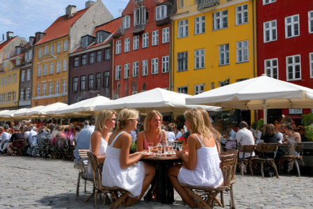Unidentified people sit in a restaurant in Copenhagen, Denmark. Copenhagen is the capital and largest city of Denmark.の素材