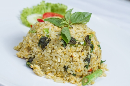 close up fried rice with green curry with chicken, Thai food on white dishの写真素材