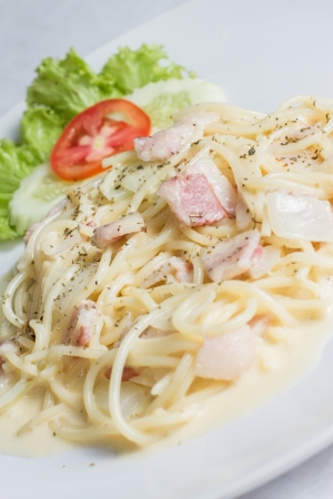 Spaghetti Carbonara with bacon on white plateの写真素材