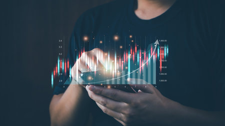 planning and strategy, stock market, business growth, business progress and success, businessman or trader is showing virtual stock holograms on smartphone, stock market traders or digital assets.の写真素材