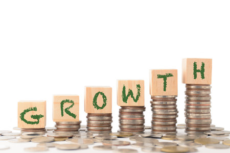 Row of coins for business background, money savings and accounts, bank finance. business concept idea, investments, funds, dividends, financial transactions, trees growing on coins, business growth.の写真素材
