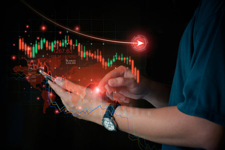 Concept, stock chart is falling during the global economic crisis. businessman using smartphone Check stock market prices online, sell stocks, economy is bad due to international conflicts.の写真素材