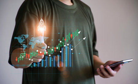 Business growing concept. Businessman using smartphone to check stock chart, stock price is going up, online stock trading, financial business banking, startups, rising chart, marketing plan.の写真素材