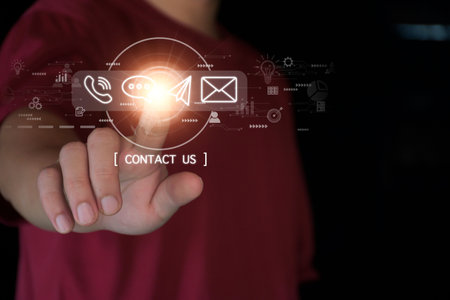 Concept Contact us or connected customer support hotline. businessman touching icon to communicate on a virtual screen,through a digital, global network. Icon (Email,Live Chat,Internet,Phone, Message)の写真素材