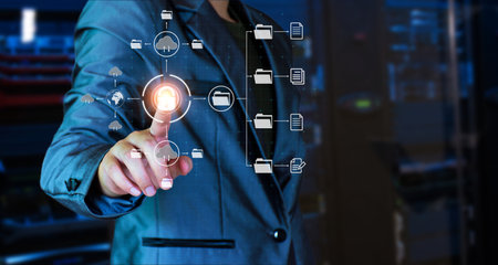 Man unlocks files in the cloud. Internet technology. Concept of global data connection by metaverse technology, big data ,search for information, online business, global network,  internet of thingsの写真素材