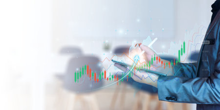 Businessman planning to invest in stock market. Businessman use pen touching virtual screen, stock...