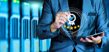 The concept of providing a five-star premium service. businessman showing award High standards are guaranteed, service quality, business success, work efficiency, top quality assurance 5 stars.の写真素材