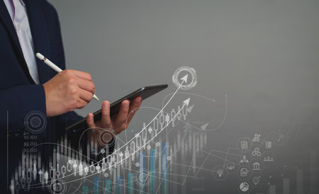 Digital business planning. Businessman are using tablets to analyze economic trends, plan long-term investments, analyze business profit stock charts, make financial plans for investments. copy space.の写真素材