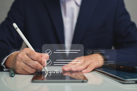 Electronic signature business concept. Manager is electronic sign an agreement on tablet, business approved, executing plan, project approved. digital signature. electronic document, digital businessの写真素材
