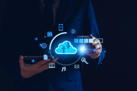 Data download from cloud computing concept. Man using smartphone and computer to download, upload...