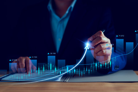 Business analysis, company profits. Businessman analyzing profit chart trends, making investment plans, trading stocks, economic trends, setting future goals. Analyze investment risks.の写真素材