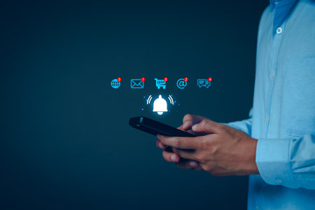 Application notification alert concept. Business people using smartphone with virtual bell ringing, New email, digital marketing, electronic message alert, online shopping connect via internet networkの写真素材