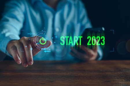 Businessman touching on virtual screen start button for 2023 New Year, Start new year 2023 with goal plan, goal concept, action plan, strategy, new year business vision. new start up business.の写真素材