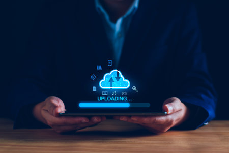 Data upload to cloud storage computing concept. Man using smartphone and computer to upload and...