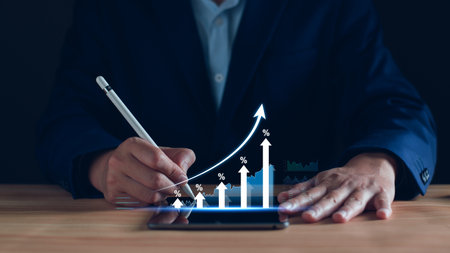 Interest rate and dividend concept. Businessman with percentage symbol and up arrow, Interest rates continue to increase, return on stocks and mutual funds, long term investment for retirement.の写真素材