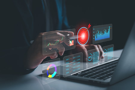 KPI to analyze performance and create insight reports for operations management. Businessman works on laptop Showing business analytics dashboard with charts, metrics, AI and Data analysis conceptの写真素材