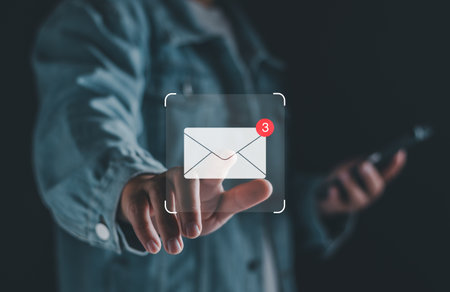 Email business marketing notification concept. Inbox receiving electronic message alert. Business email communication, digital marketing. business people touch on email in virtual screen technology.の写真素材
