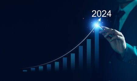 Business growth 2024 concept. Businessman analyze new year trend of future business technology, economic, marketing, opportunity investment, financial, calendar plan, business goal and success.の写真素材