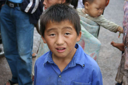 XIENG KHOUANG , LAOS - JUNE 16 : Laotian Hmong children in a village by the road near Xieng Khouang Province on 16 June 2005のeditorial素材