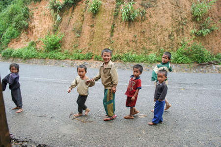 XIENG KHOUANG , LAOS - JUNE 16 : Laotian Hmong children in a village by the road near Xieng Khouang Province on 16 June 2005のeditorial素材