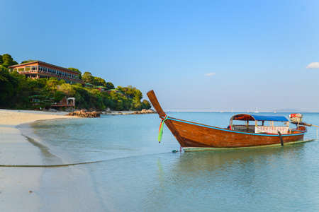 Longtail boat at mountain beach, Lipe island, Thailandのeditorial素材
