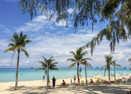 Boracay, Philippines - July 21, 2015 : People relaxing on the beach with blue sky on Boracay islandのeditorial素材