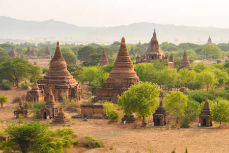 Bagan, Myanmar - April 22, 2016 :  Group of ancient pagodas in Bagan at Sunset