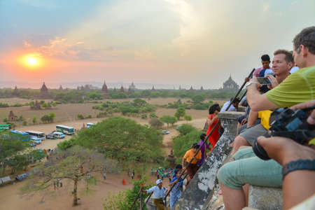 Bagan, Myanmar - April 22, 2016 :  Group of tourist viewing to see  Sunset on the top of  Shwesandaw Pagodaのeditorial素材