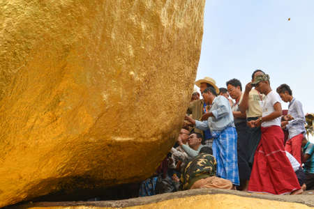 Kyaiktiyo, Mon state, Myanmar- April 24, 2016: Buddhist prayers at Kyaiktiyo Pagoda (Golden Rock), One of the most Buddhist worshipful place in Myanmar.のeditorial素材