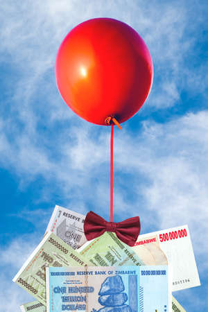 Concept of inflation and currency fluctuations, Hyperinflation, Zimbabwe banknoteの写真素材