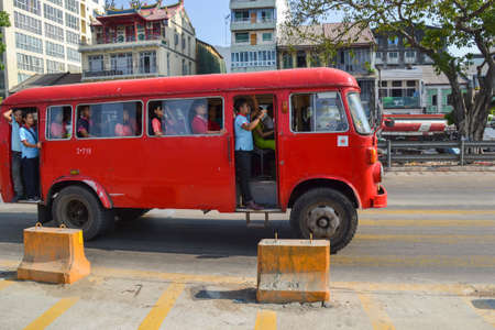 Yangon, Myanmar - April 25, 2016 :  People commuting on the very old bus in Yangonのeditorial素材