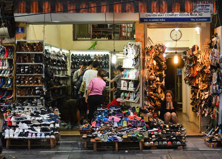 Hanoi, Vietnam - Feb 19, 2107  : A woman is sitting in her shop specialized in the selling of shoes in Hanoi, Vietnamのeditorial素材