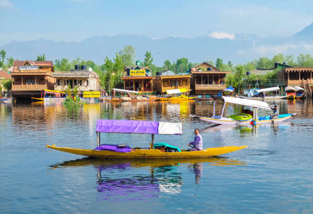 Srinagar,  India - April 25, 2017 : Lifestyle in Dal lake, People living in 'House boat' and using  small boat 'Shikara' for transportationのeditorial素材
