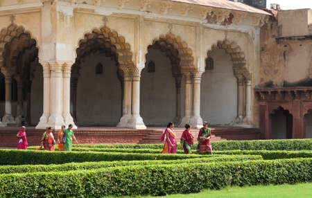 Agra, India - April 30, 2017 : Indian people walking by Khas Mahal and facing garden, Agra Fort, Agra, Indiaのeditorial素材